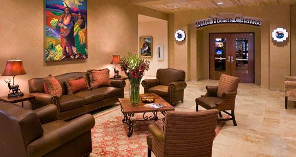 Hotel lobby lounge with seating and the Wild Horse Casino entrance