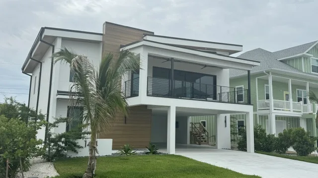 Elevated coastal home garage under – Elevated Homes by Kancor Companies, Fort Myers Beach, FL