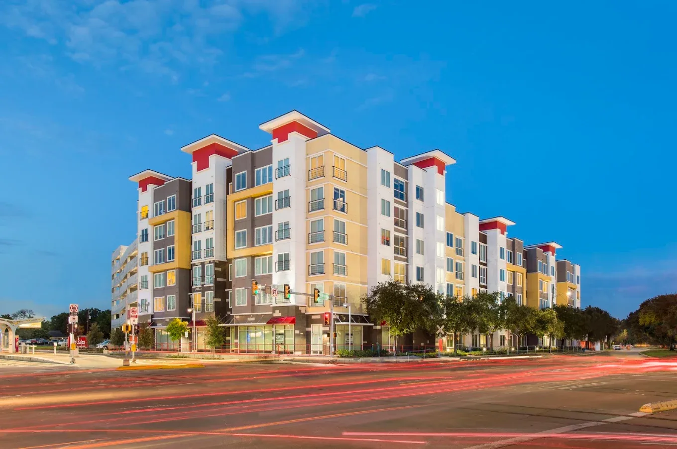 Completed ICON student housing exterior at dusk, photographed across the street, a Kancor Companies multifamily project in Tampa, Florida