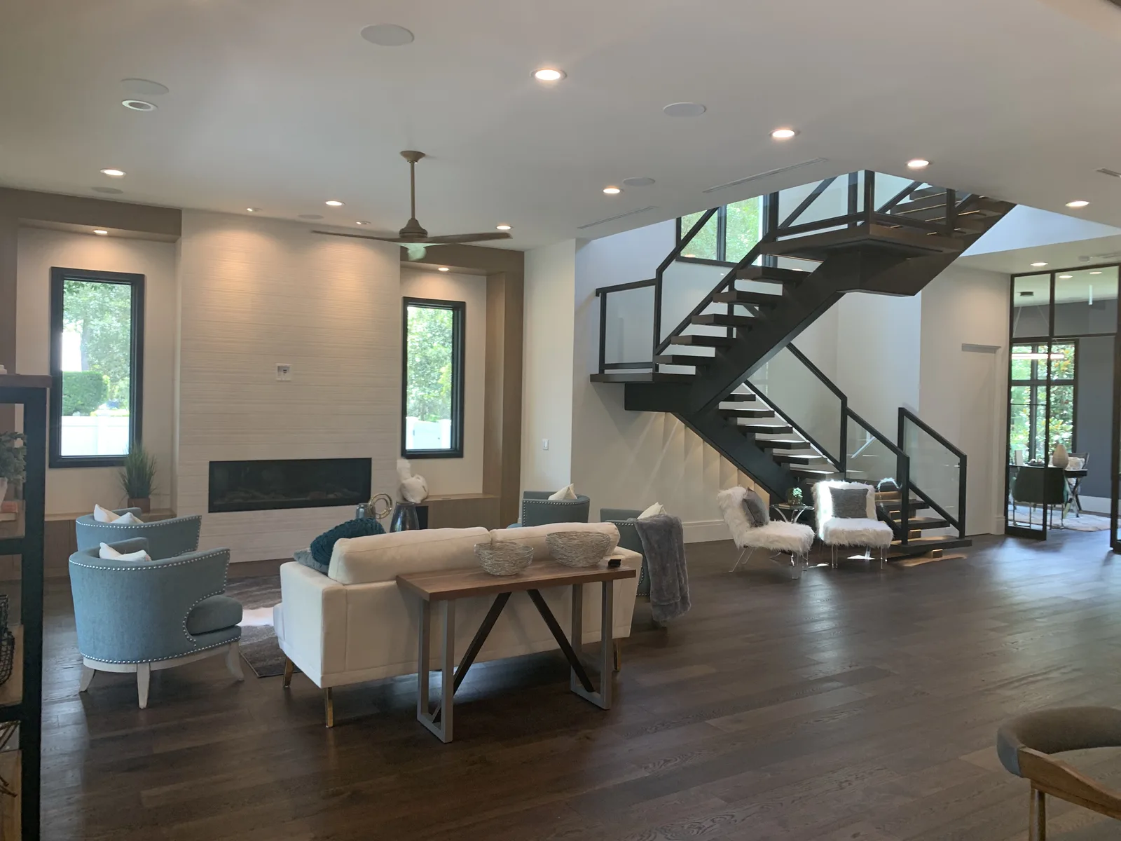 Living room with a floating staircase