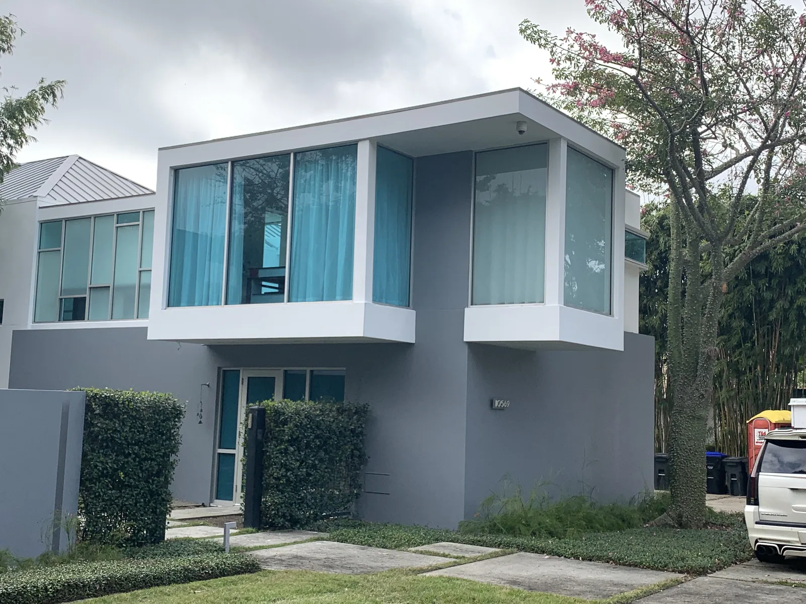 Modern two-story home with a glass corner